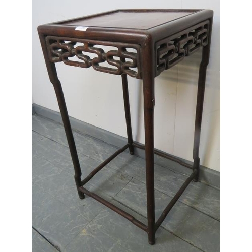 780 - An early 20th century Chinese rosewood occasional table/plant stand, with carved and pierced frieze ... 