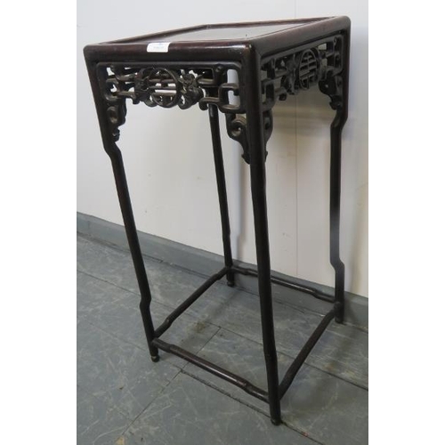 781 - An early 20th century Chinese rosewood occasional table/plant stand, with open fretwork frieze to fo... 