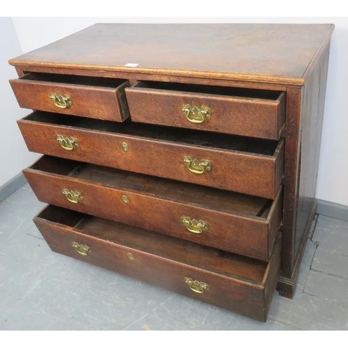 782 - A Georgian oak chest of two short over three long drawers, with brass swan neck handles and lock esc... 