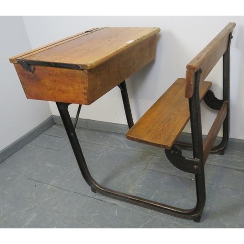 784 - A vintage elm and beech school desk with cast iron frame. 
Condition report: Inkwell missing. Variou... 