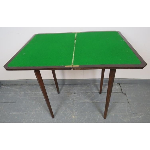 790 - An Edwardian mahogany turnover card table, with inset green baize, on tapering square supports. 
Con... 