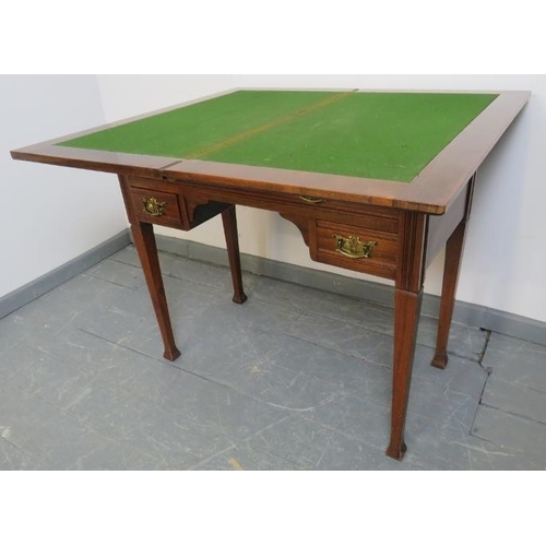 803 - An Edwardian mahogany turnover card table, with inset tooled leather writing surface, housing one lo... 