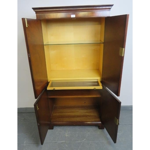 805 - A good quality reproduction flame mahogany drinks cabinet in the Georgian taste, strung with satinwo... 