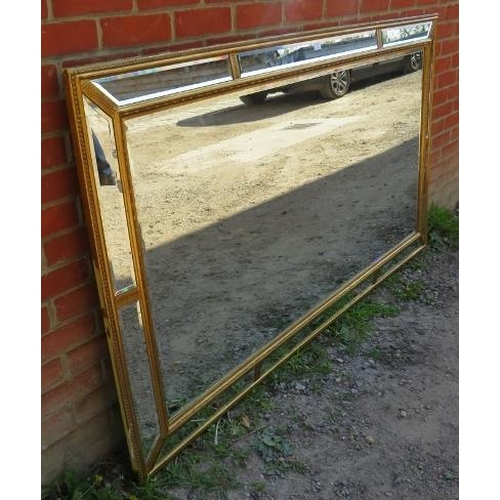 811 - A very large period style gilt framed bevelled rectangular wall mirror, with sectioned mirrored bord... 