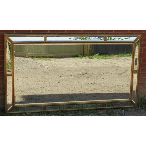 811 - A very large period style gilt framed bevelled rectangular wall mirror, with sectioned mirrored bord... 