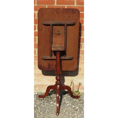 816 - A Victorian mahogany rectangular tilt-top wine table, on a baluster turned column and tripod base.
C... 