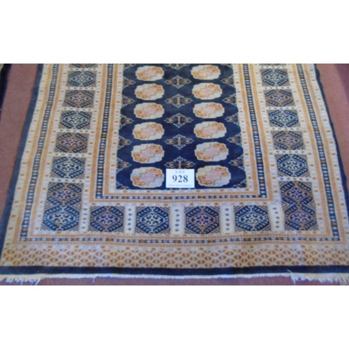 928 - A mid 20's Persian rug.
A repeat central pattern orange/cream on black.  196cm x 125cm (approx).
Con... 