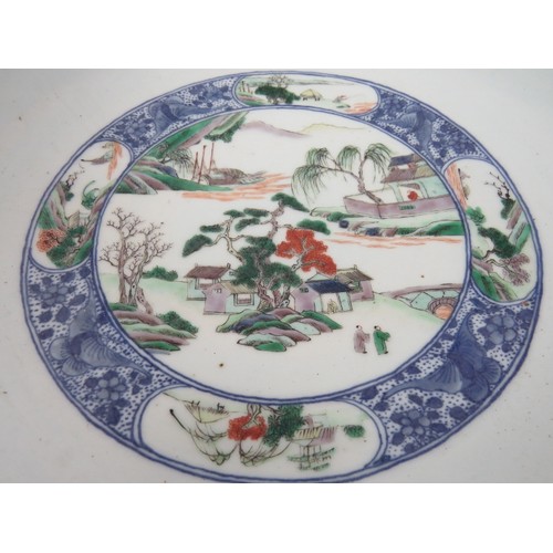 48 - A large Chinese porcelain bowl decorated in the Famille Verte style with enamelled panels depicting ... 