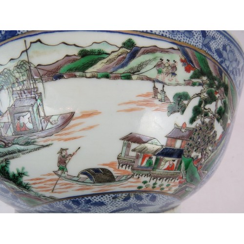 48 - A large Chinese porcelain bowl decorated in the Famille Verte style with enamelled panels depicting ... 