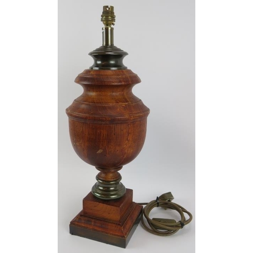 100 - A large turned wood table lamp of baluster form with patinated brass mounts. Height 54cm.
Condition ... 