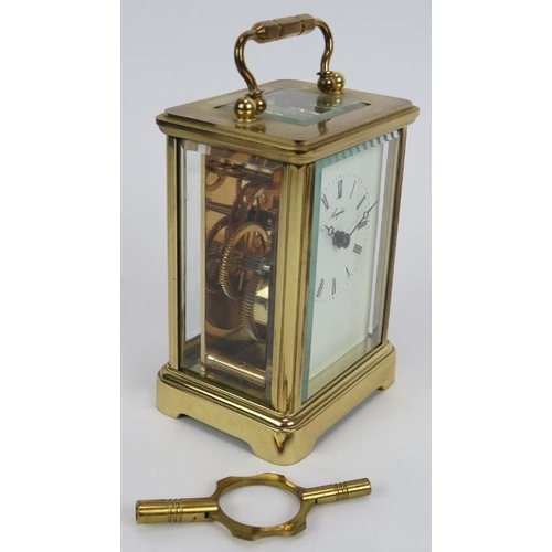 105 - A brass cased Angelus 8 day carriage clock with 11 jewel movement,  original packaging, paperwork an... 