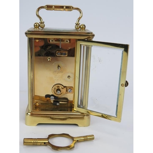 105 - A brass cased Angelus 8 day carriage clock with 11 jewel movement,  original packaging, paperwork an... 