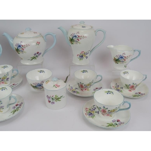 107 - A 24 piece six setting Shelley wildflowers tea service with plates, cups and saucers, tea and coffee... 