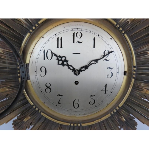 108 - A 1930s carved wood gilt sunburst clock with Astral Coventry fusee movement and key. Width 92cm. Hei... 