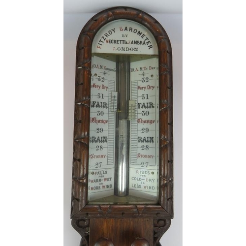 11 - An antique Negretti & Zambra Fitzroy barometer in ornate oak case. Height 108cm.
Condition report: C... 