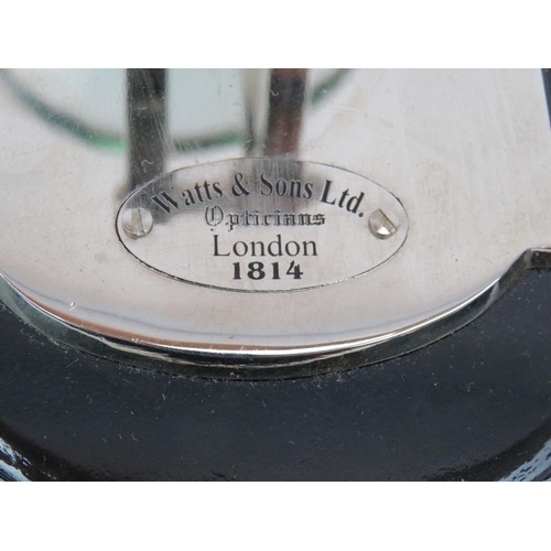 116 - An antique style folding desk magnifying glass labelled for Watts & Sons Ltd Opticians and a cast al... 