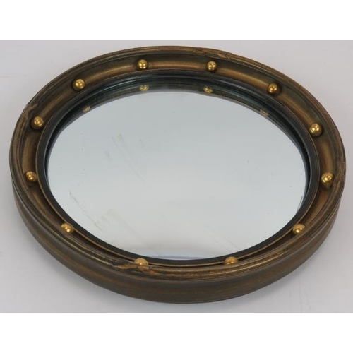 119 - A small vintage round convex mirror in gilt frame, 24cm diameter.
Condition report: One crack to fra... 