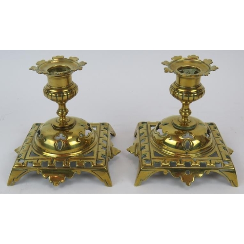 128 - An aesthetic movement brass desk stand and ink wells, a pair of Gothic brass candlesticks, Art Nouve... 