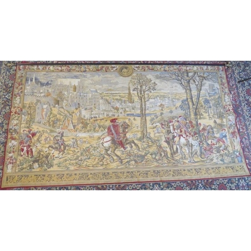 13 - A large contemporary machine woven Flemish tapestry depicting medieval scenes, mounted on a steel po... 