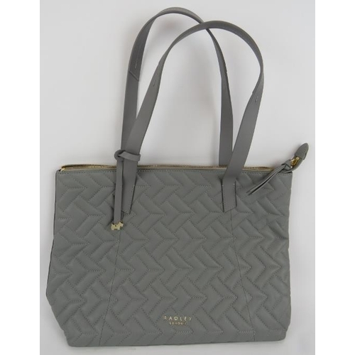 156 - A large Radley grey leather tote bag with quilted front and fully lined. Original dust bag. All hand... 