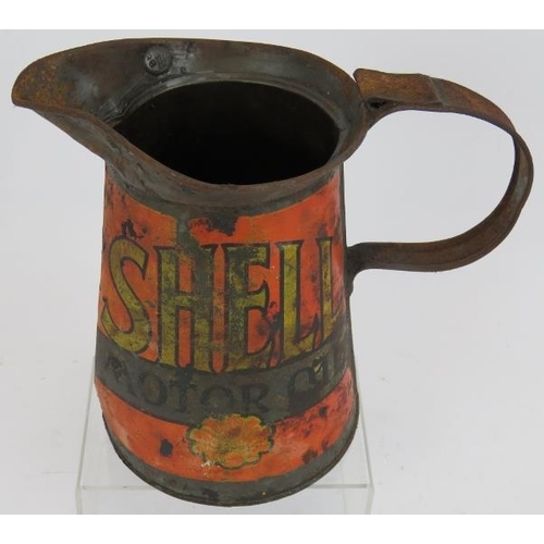 170 - A vintage Shell motor oil quart jug circa 1930 with lead excise measure seal. Height 18cm.
Condition... 