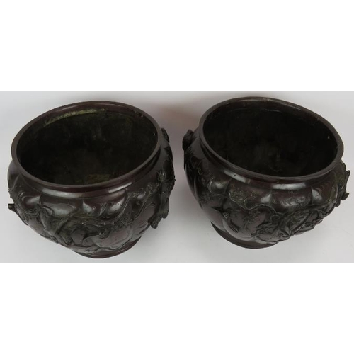 25 - A large pair of Japanese Meiji period bronze jardinière planters of fluted form with bird in tree de... 