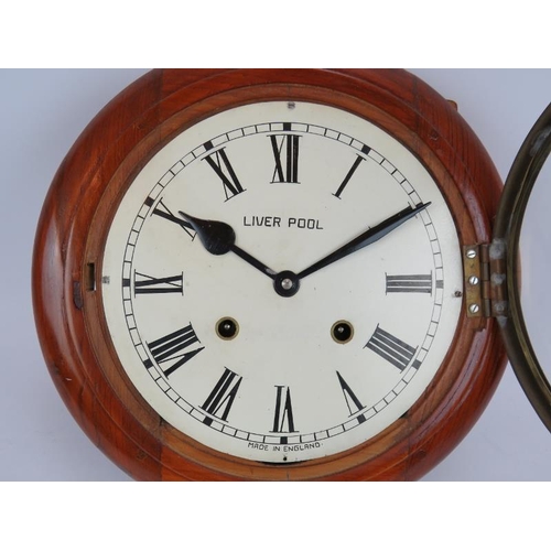 26 - A 19th century striking wall clock with painted dial marked Liverpool. Diameter 35cm. Key and pendul... 