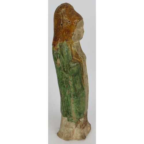 32 - A small Chinese Sancai funerary figure with green glaze cloak and amber glazed hood. Probably Tang D... 