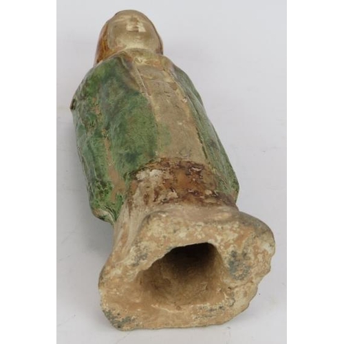 32 - A small Chinese Sancai funerary figure with green glaze cloak and amber glazed hood. Probably Tang D... 