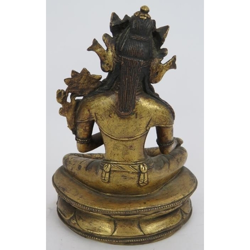 35 - A fine antique gilt bronze Buddha figure of Tibetan deity Tara seated on a lotus leaf base. The base... 