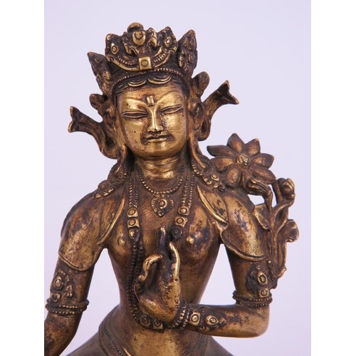 35 - A fine antique gilt bronze Buddha figure of Tibetan deity Tara seated on a lotus leaf base. The base... 