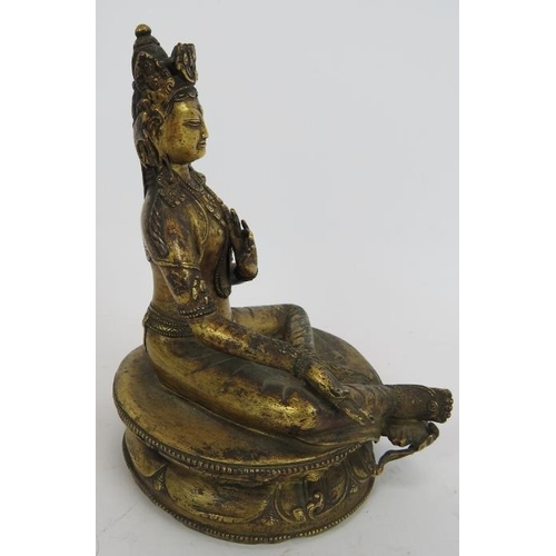 35 - A fine antique gilt bronze Buddha figure of Tibetan deity Tara seated on a lotus leaf base. The base... 