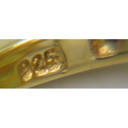 368 - A large peridot ring, setting 25mm x 20mm, size Q, oval brilliant cut stones, good cut, colour & cla... 