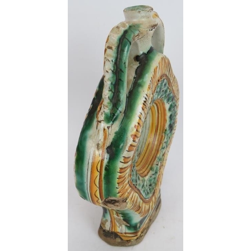 37 - An early European Majolica pottery flask in green and amber tin glaze and with twin pinched handles.... 