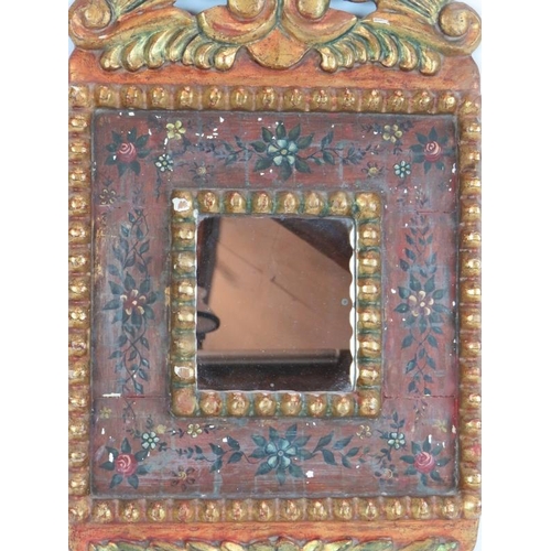 42 - A gilt wood and gesso Spanish colonial style mirror with ornate gilt frame and hand decorate border ... 