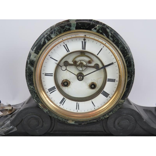 46 - A late 19th century green marble and slate Napoleon style striking mantel clock with French movement... 