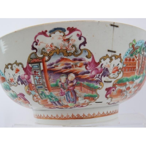 49 - A large 18th century Chinese porcelain bowl decorated in coloured enamels depicting European hunting... 