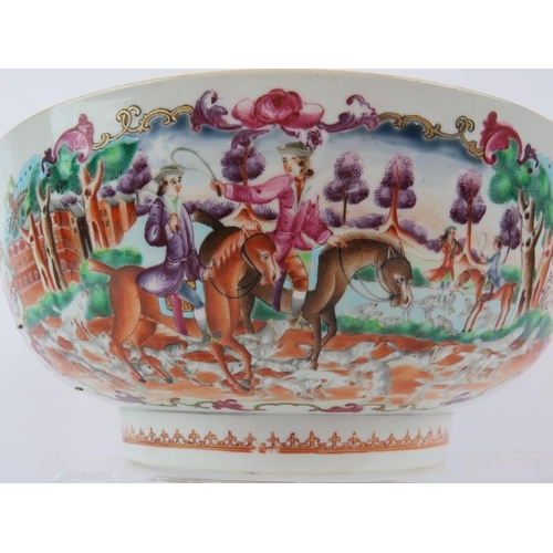 49 - A large 18th century Chinese porcelain bowl decorated in coloured enamels depicting European hunting... 