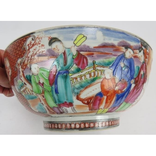 50 - A large 18th century Chinese porcelain bowl decorated in coloured enamels depicting Chinese figures ... 