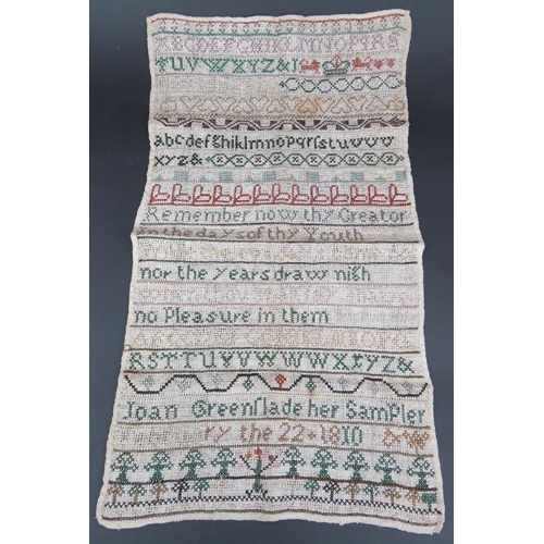 53 - An unframed Georgian needlework sampler dated 1810, a 19th century Christening gown, a lace collar, ... 