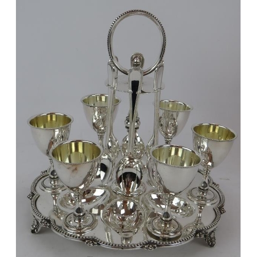 54 - A late Victorian silver plated spirit kettle by Martin Hall & Co and a six piece silver plated egg s... 