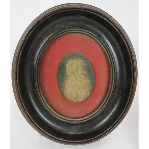 64 - An early 19th century portrait miniature of a girl, watercolour on card, mounted in a gilt brass eas... 