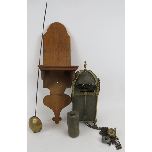 66 - An Antique 17th century style brass lantern clock, engraved 'Dadswell, Burwash', with later oak wall... 