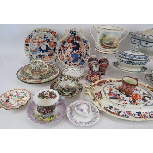 69 - A quantity of mainly 19th Century ceramics including a presentation loving cup, tureens, plates, cup... 