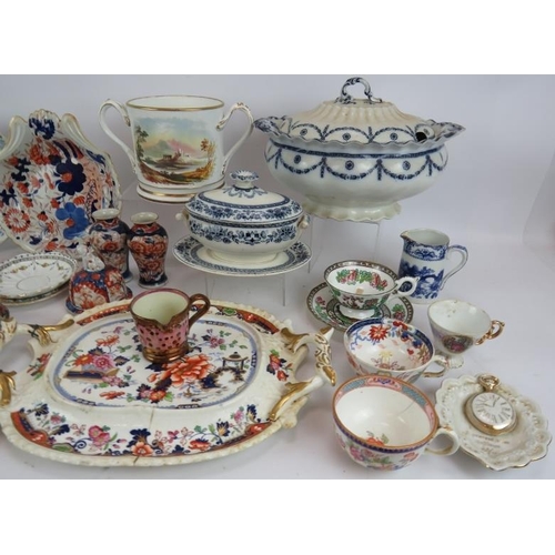 69 - A quantity of mainly 19th Century ceramics including a presentation loving cup, tureens, plates, cup... 