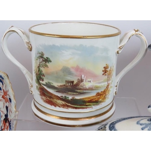 69 - A quantity of mainly 19th Century ceramics including a presentation loving cup, tureens, plates, cup... 