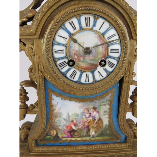 79 - A 19th Century Ormulu striking mantel clock with hand decorated porcelain dial and panels. Movement ... 