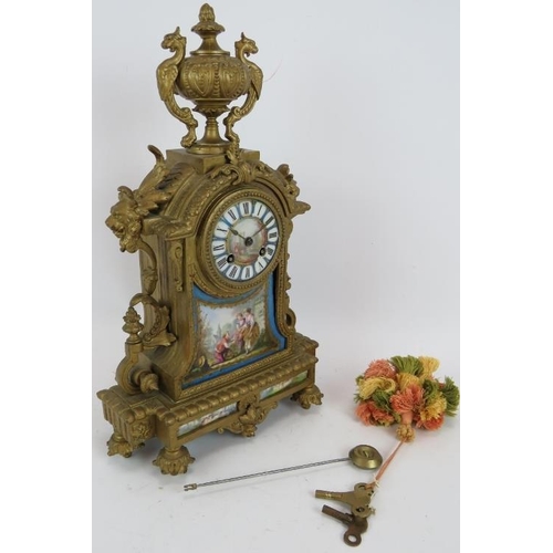 79 - A 19th Century Ormulu striking mantel clock with hand decorated porcelain dial and panels. Movement ... 