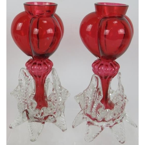 84 - A pair of Victorian triple lobed cranberry glass garnitures, three pieces of hand enamelled and gild... 