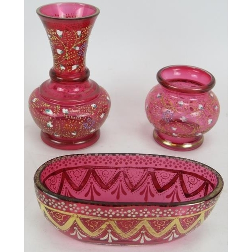 84 - A pair of Victorian triple lobed cranberry glass garnitures, three pieces of hand enamelled and gild... 